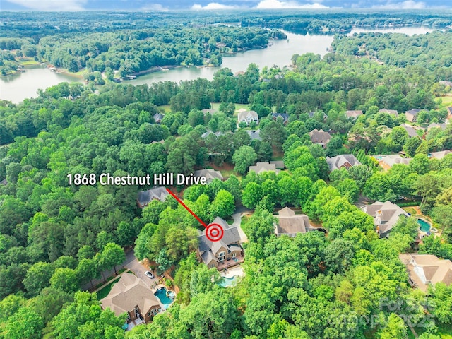 1868 Chestnut Hill Dr, Tega Cay, SC 29708 - aerial view of property and surrounding area with a large body of water, a heavily wooded area, and nearby suburban area