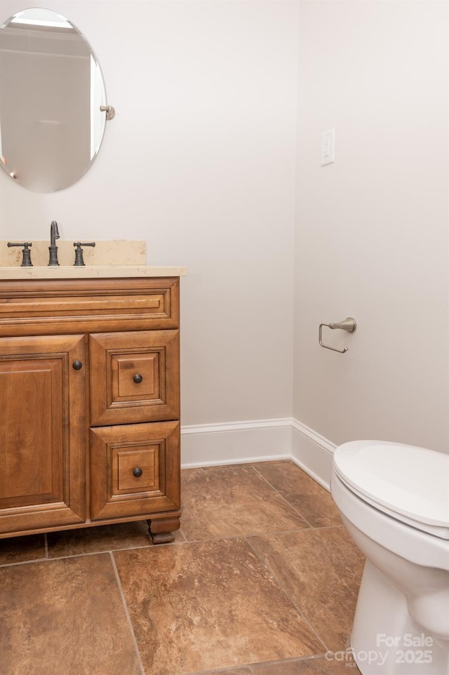 113 Elwood St, Kannapolis, NC 28081 - bathroom featuring vanity, toilet, and baseboards