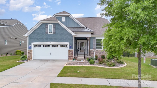 1663 Tranquility Blvd, Lancaster, SC 29720 - craftsman-style house featuring a front lawn, stone siding, concrete driveway, and an attached garage