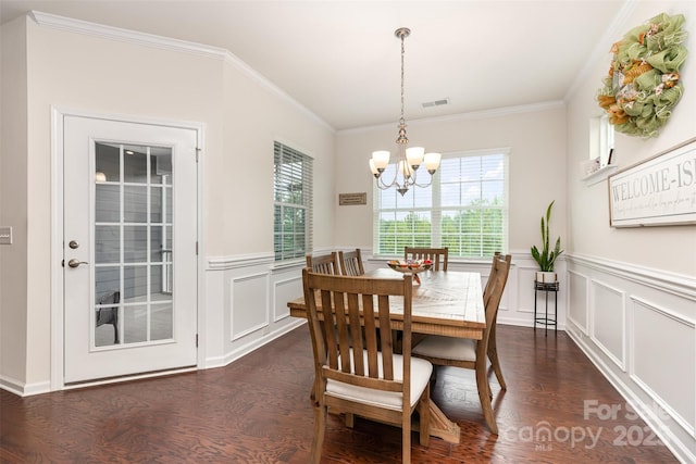 1663 Tranquility Blvd, Lancaster, SC 29720 - dining space with a chandelier, crown molding, dark wood-style flooring, wainscoting, and a decorative wall