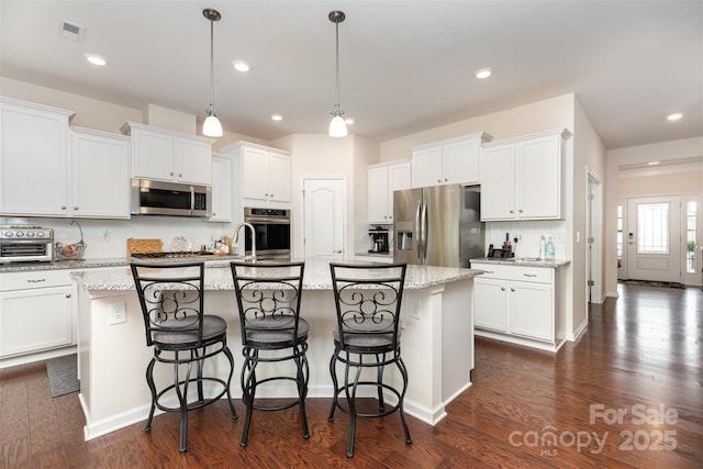 1663 Tranquility Blvd, Lancaster, SC 29720 - kitchen featuring stainless steel appliances, backsplash, white cabinets, and recessed lighting