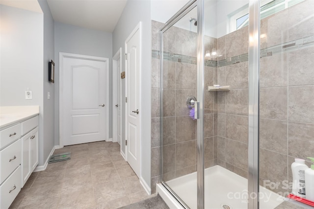 1663 Tranquility Blvd, Lancaster, SC 29720 - full bathroom with a stall shower, vanity, and baseboards