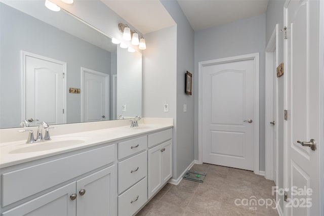 1663 Tranquility Blvd, Lancaster, SC 29720 - bathroom with double vanity and baseboards
