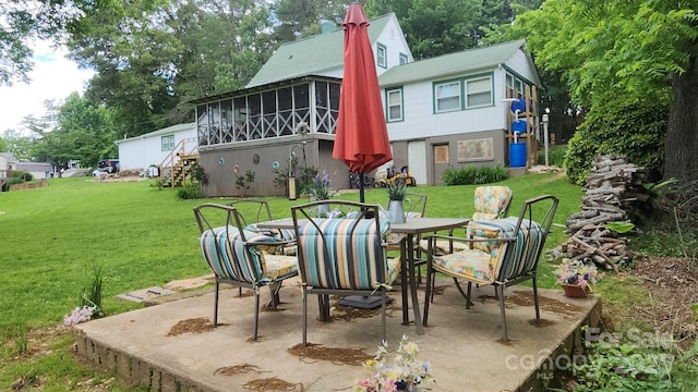100 Frank St, Connelly Springs, NC 28612 - view of patio / terrace featuring a sunroom, outdoor dining space, and stairway