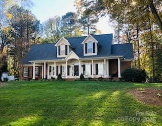 390 Robinson Rd, Mooresville, NC 28117 - cape cod house featuring a front lawn