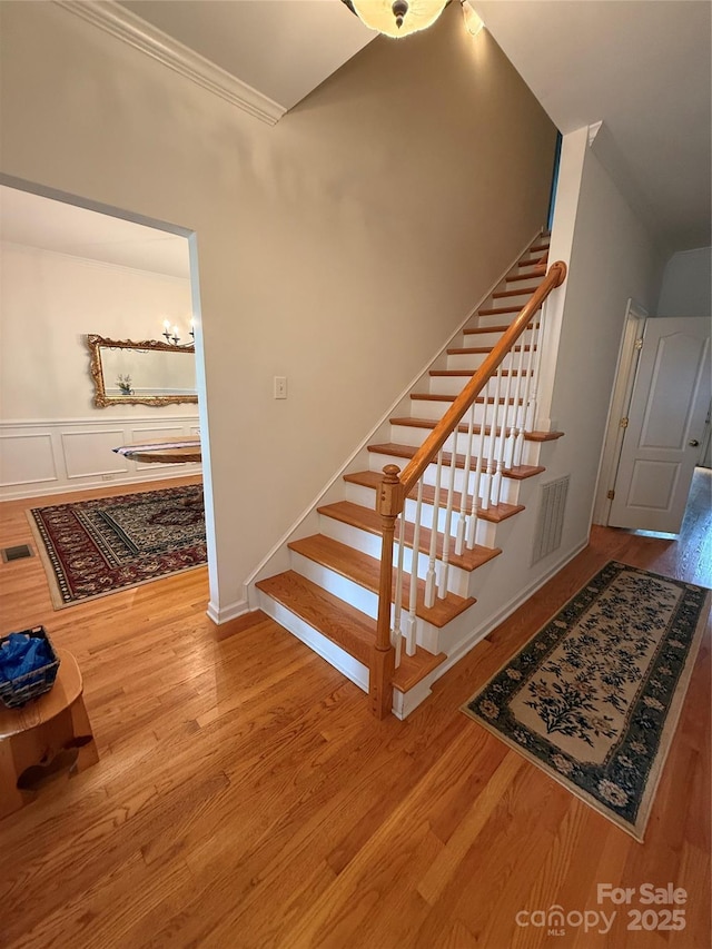 390 Robinson Rd, Mooresville, NC 28117 - stairs with wood finished floors and ornamental molding