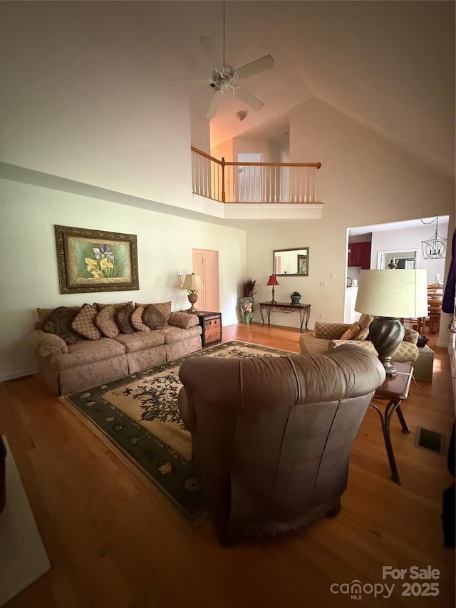 390 Robinson Rd, Mooresville, NC 28117 - living room featuring high vaulted ceiling, a ceiling fan, and wood finished floors
