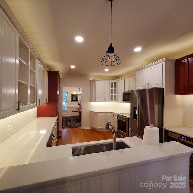 390 Robinson Rd, Mooresville, NC 28117 - kitchen with appliances with stainless steel finishes, a sink, backsplash, light wood-type flooring, and recessed lighting