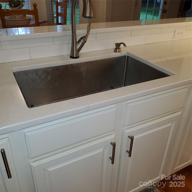 390 Robinson Rd, Mooresville, NC 28117 - kitchen view of a sink and white cabinets