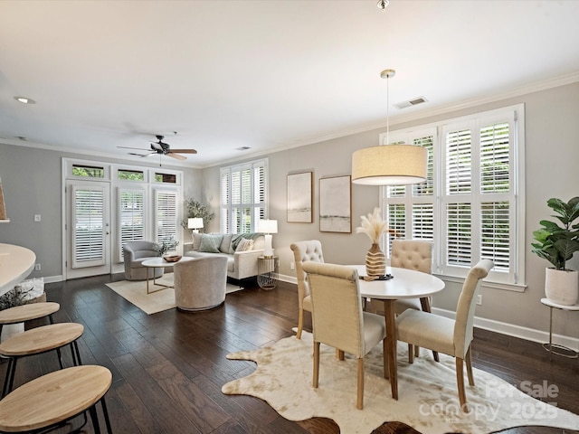 416 Queens Rd Unit 10, Charlotte, NC 28207 - dining room with ornamental molding, dark wood-style floors, baseboards, plenty of natural light, and ceiling fan