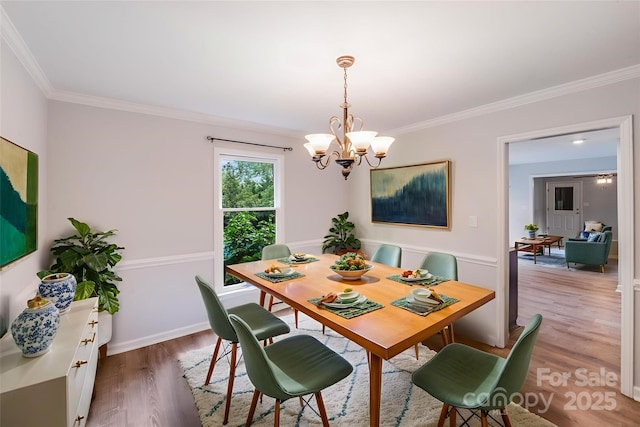 16512 Kimbolten Dr, Huntersville, NC 28078 - dining area featuring a chandelier, ornamental molding, wood finished floors, and baseboards