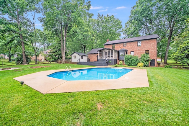 16512 Kimbolten Dr, Huntersville, NC 28078 - view of swimming pool with a sunroom, a patio, a deck, and an outbuilding