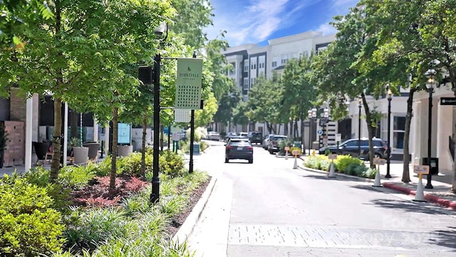 16512 Kimbolten Dr, Huntersville, NC 28078 - view of asphalt road with sidewalks, curbs, and street lights