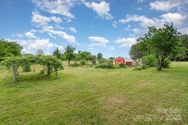 1720 Lowe Dr, Catawba, NC 28609 - view of green lawn with an outbuilding and a barn