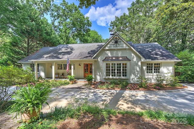 6741 Folger Dr, Charlotte, NC 28270 - view of front of house with roof with shingles, a porch, and a chimney