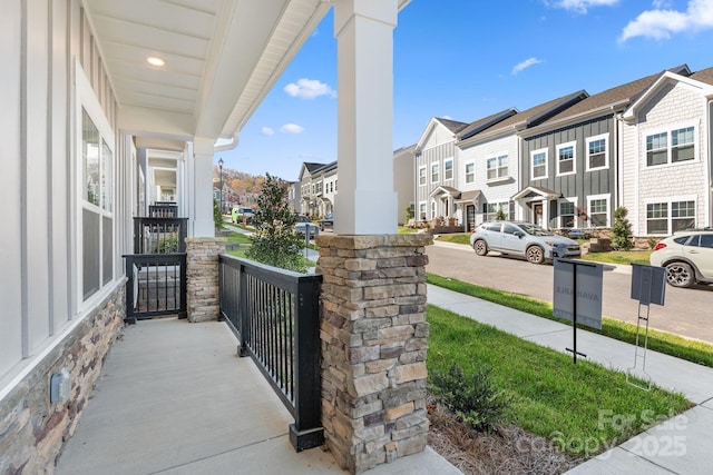 191 Cherry Springs Ln Unit 24-F, Asheville, NC 28804 - covered porch with a residential view
