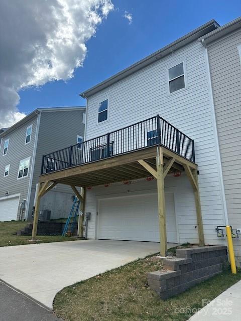 191 Cherry Springs Ln Unit 24-F, Asheville, NC 28804 - view of front of property featuring a garage, driveway, and a deck