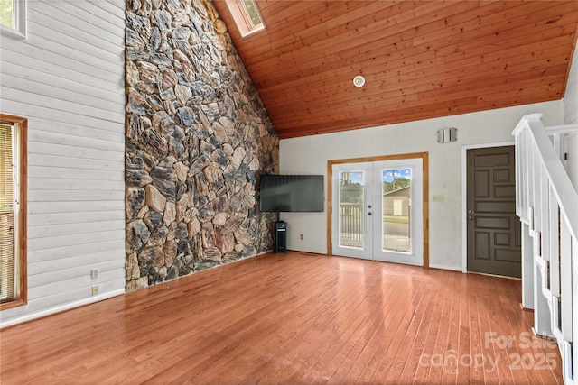 296 Hicks Creek Rd, Troutman, NC 28166 - unfurnished living room with wood finished floors, high vaulted ceiling, french doors, wooden ceiling, and a skylight