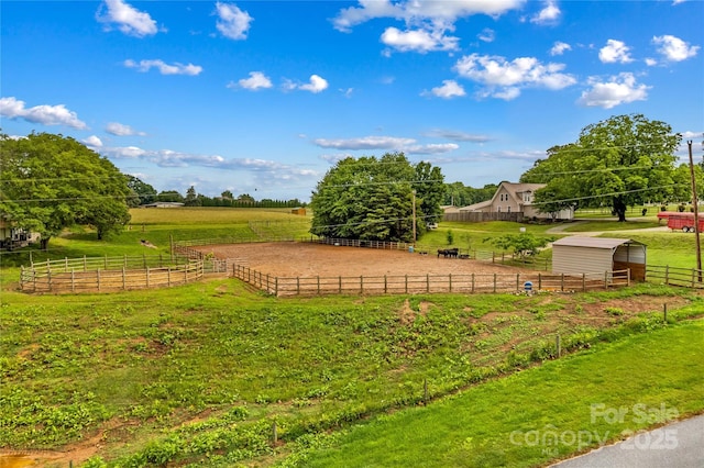 296 Hicks Creek Rd, Troutman, NC 28166 - view of yard featuring a rural view, an outbuilding, an exterior structure, and an outdoor riding arena