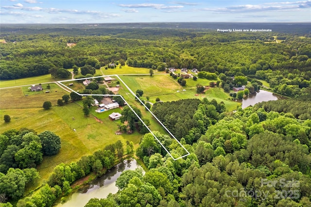 296 Hicks Creek Rd, Troutman, NC 28166 - aerial overview of property's location with a heavily wooded area, property boundaries highlighted, and a nearby body of water