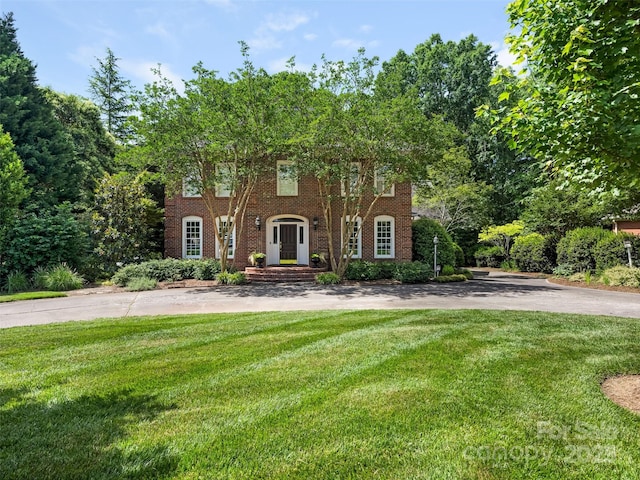 4026 Sharon View Rd, Charlotte, NC 28226 - georgian-style home with a front lawn and brick siding