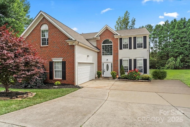 13528 Philip Michael Rd, Huntersville, NC 28078 - view of front facade with concrete driveway, a front lawn, and brick siding