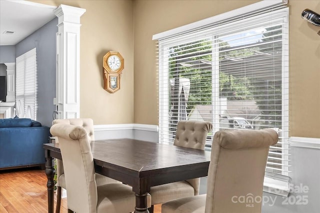 13528 Philip Michael Rd, Huntersville, NC 28078 - dining room with light wood finished floors and ornate columns