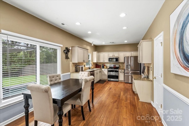13528 Philip Michael Rd, Huntersville, NC 28078 - dining space with wood finished floors and recessed lighting