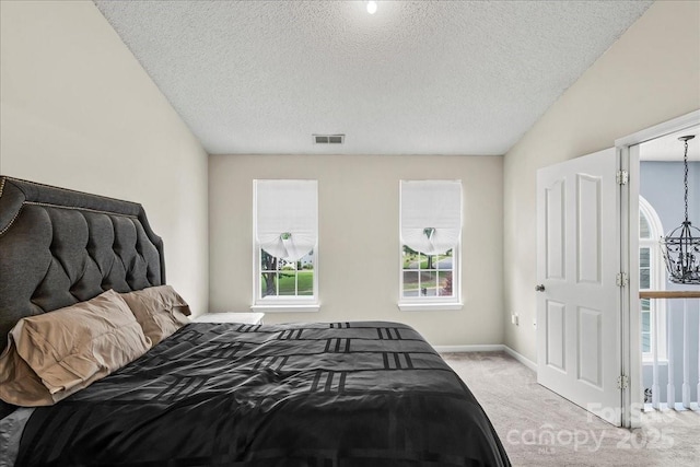 13528 Philip Michael Rd, Huntersville, NC 28078 - carpeted bedroom featuring a textured ceiling and baseboards