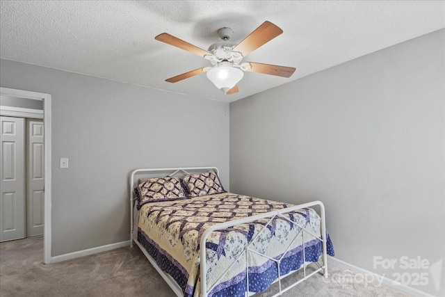 13528 Philip Michael Rd, Huntersville, NC 28078 - carpeted bedroom featuring a ceiling fan and a textured ceiling