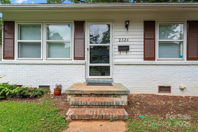 2328 Danforth Ln, Charlotte, NC 28208 - doorway to property with crawl space and brick siding