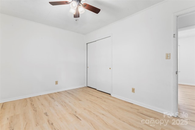 2328 Danforth Ln, Charlotte, NC 28208 - unfurnished bedroom featuring wood finished floors, a closet, and baseboards