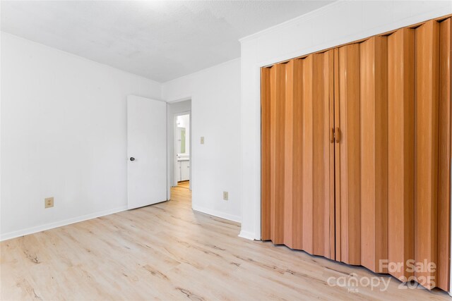 2328 Danforth Ln, Charlotte, NC 28208 - unfurnished bedroom with light wood-style flooring and baseboards