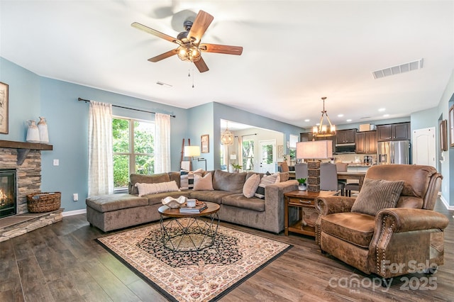 5092 Nighthawk Dr, Indian Land, SC 29707 - living room with a chandelier, plenty of natural light, a stone fireplace, a ceiling fan, and recessed lighting