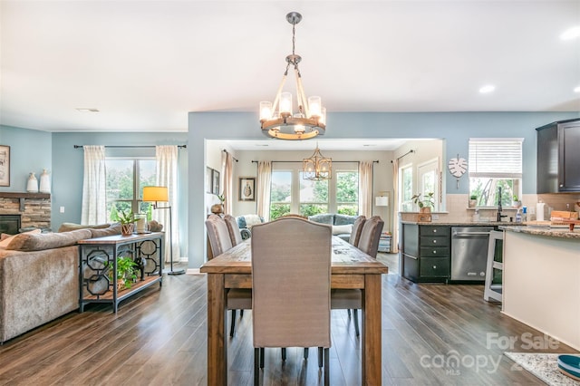 5092 Nighthawk Dr, Indian Land, SC 29707 - dining area with a chandelier, dark wood-style floors, plenty of natural light, and recessed lighting