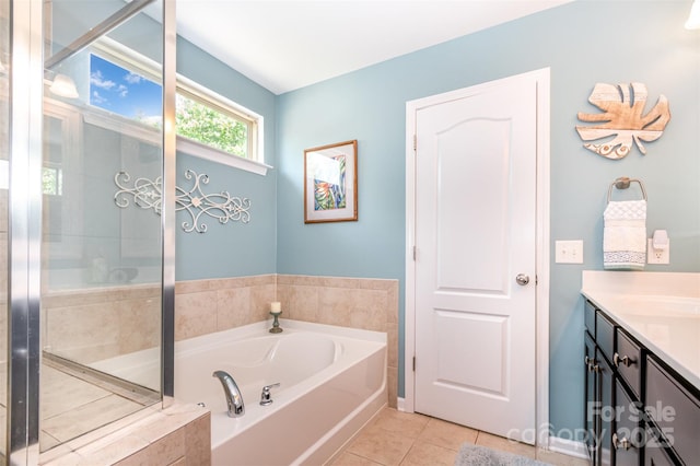 5092 Nighthawk Dr, Indian Land, SC 29707 - bathroom featuring a garden tub, vanity, tile patterned floors, and an enclosed shower
