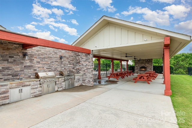 5092 Nighthawk Dr, Indian Land, SC 29707 - view of patio with a lit fireplace and a sink