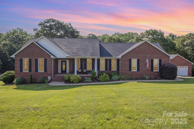 214 Silver Creek Ln, Shelby, NC 28152 - ranch-style house featuring brick siding, covered porch, a front yard, and an outdoor structure