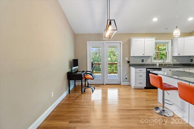 39 Curtis Miles Rd, Alexander, NC 28701 - kitchen with dishwasher, light wood finished floors, white cabinets, a kitchen bar, and recessed lighting