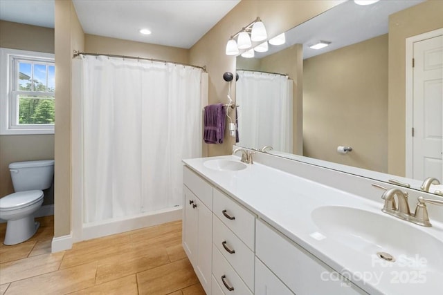 39 Curtis Miles Rd, Alexander, NC 28701 - bathroom with toilet, double vanity, a shower with shower curtain, baseboards, and recessed lighting