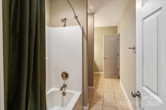39 Curtis Miles Rd, Alexander, NC 28701 - full bath featuring tile patterned flooring, shower / bath combo with shower curtain, and baseboards