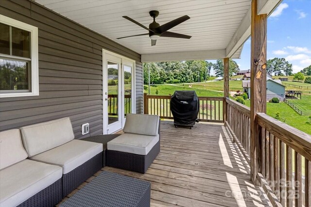 39 Curtis Miles Rd, Alexander, NC 28701 - wooden deck with ceiling fan, area for grilling, outdoor lounge area, and a lawn