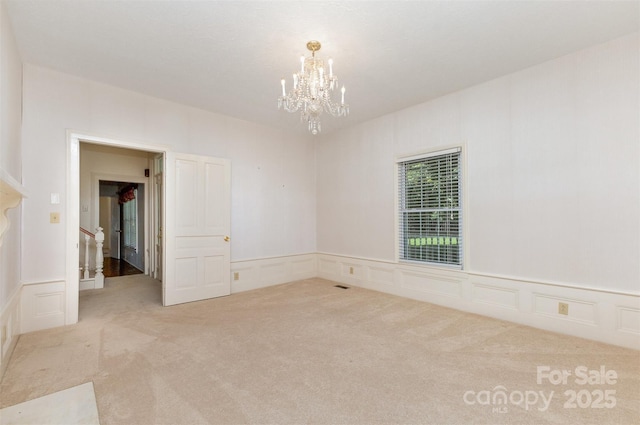 130 Merton Rd, Lawndale, NC 28090 - unfurnished room featuring a decorative wall, a chandelier, carpet floors, and a wainscoted wall