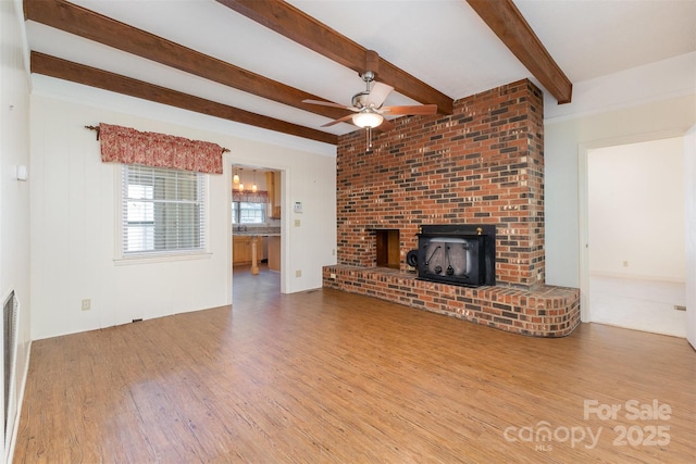 130 Merton Rd, Lawndale, NC 28090 - unfurnished living room with wood finished floors, a ceiling fan, beamed ceiling, and a sink