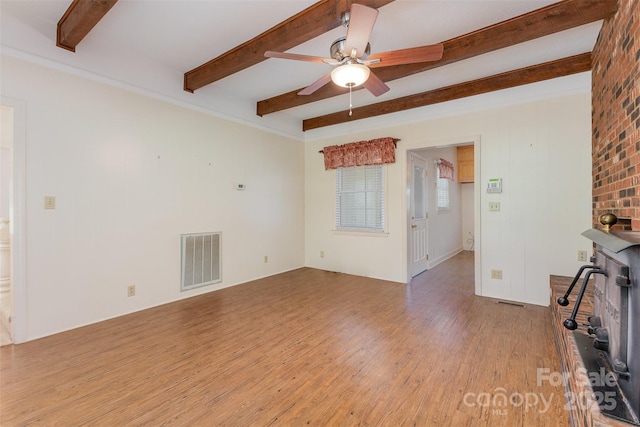 130 Merton Rd, Lawndale, NC 28090 - unfurnished living room with beamed ceiling, wood finished floors, and ceiling fan