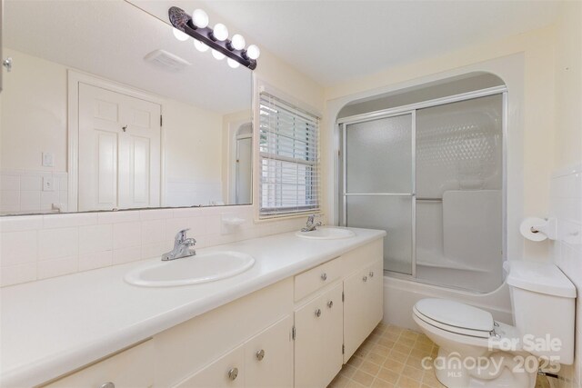 130 Merton Rd, Lawndale, NC 28090 - full bathroom with double vanity, toilet, and enclosed tub / shower combo