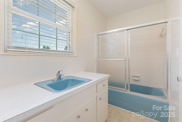 130 Merton Rd, Lawndale, NC 28090 - full bath with vanity, enclosed tub / shower combo, and decorative backsplash