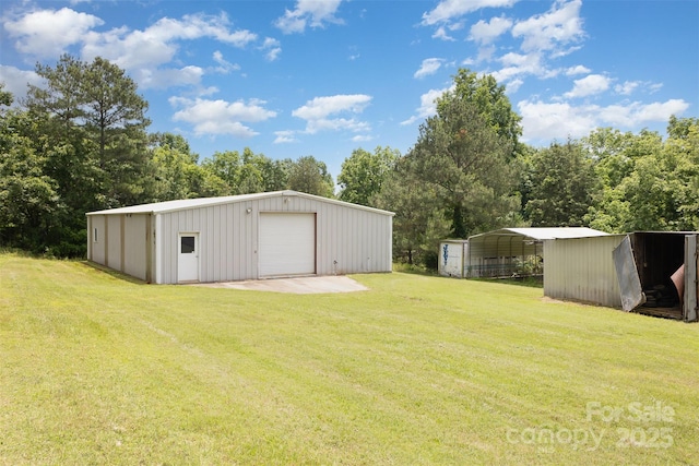 130 Merton Rd, Lawndale, NC 28090 - view of grassy yard with a detached garage, an outdoor structure, and driveway