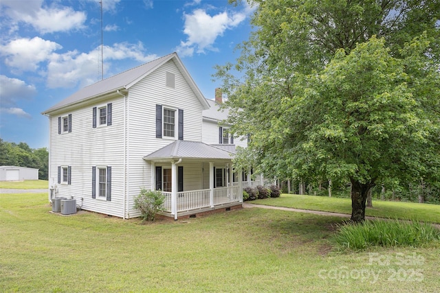 130 Merton Rd, Lawndale, NC 28090 - view of front of property with covered porch, a front yard, metal roof, and central AC unit