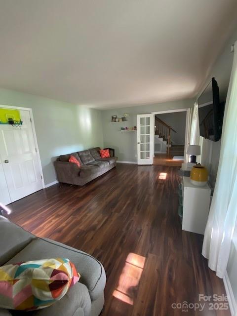 734 Forestbrook Dr, Gastonia, NC 28056 - living room featuring dark wood-style flooring and stairs